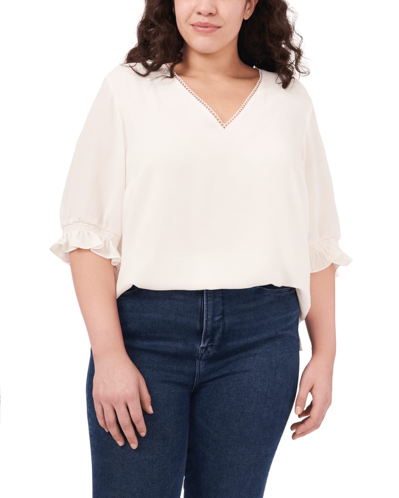 Front of a model wearing a size 1X Eleanor Ruffle Sleeve Blouse in SOFT ECRU by CeCe. | dia_product_style_image_id:263338